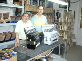 Alex and Sergio Capecci, Export Manager for Ottavianelli Accordions inside the factory. 