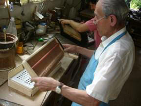 Working on an accordion in the Alessandrini workshop. 